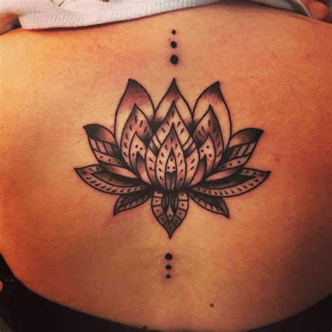 floral lower back tattoo designs|lotus flower lower back tattoo.